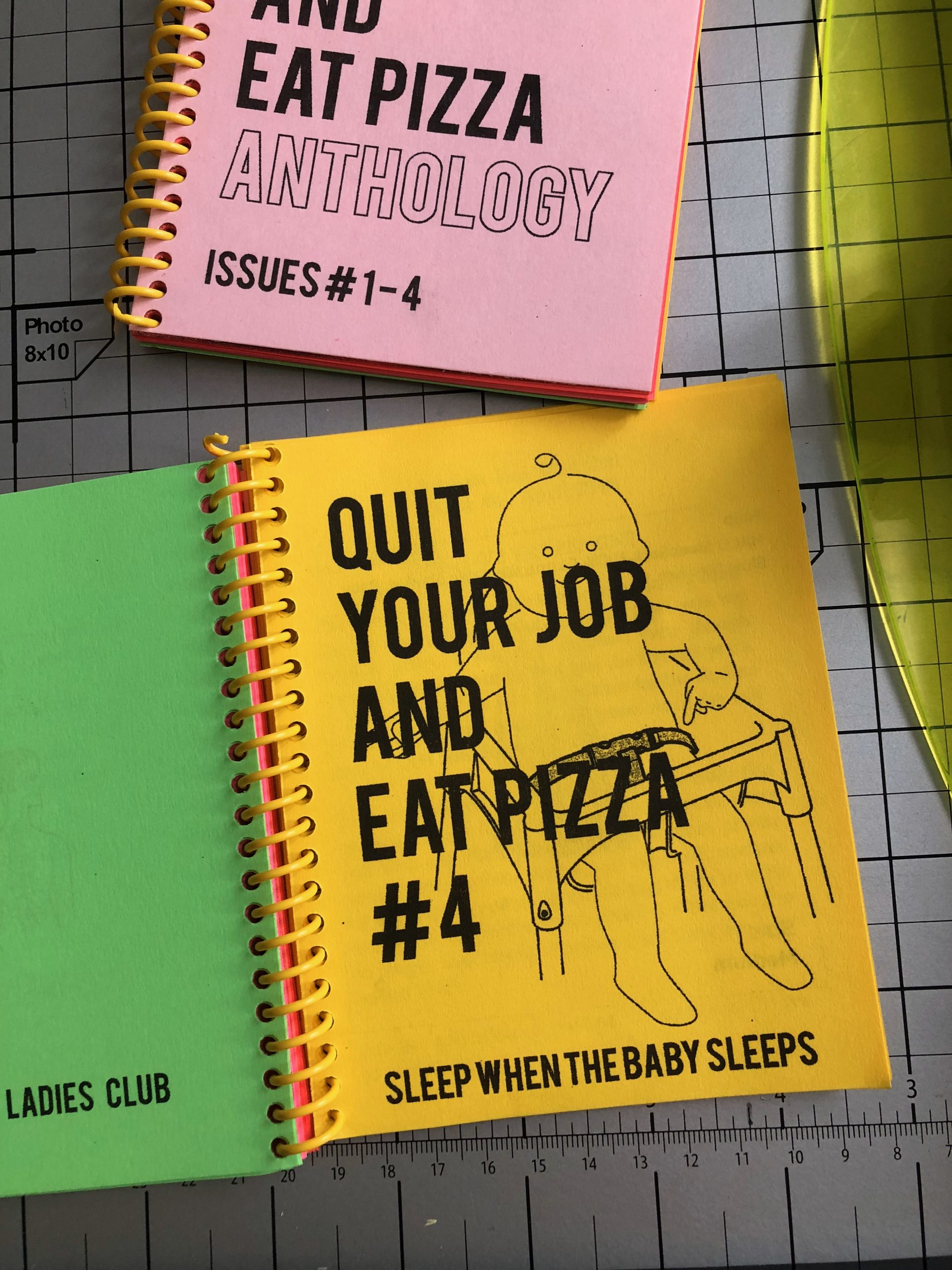 ring bownd book that says "quit your job and eat pizza"