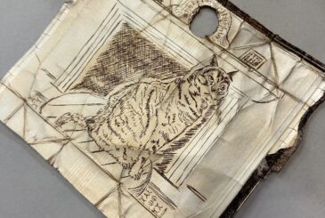 Torn sketchbook page with a detailed line drawing of a wolf in a room, surrounded by architectural sketches and a circular hole near the top edge.