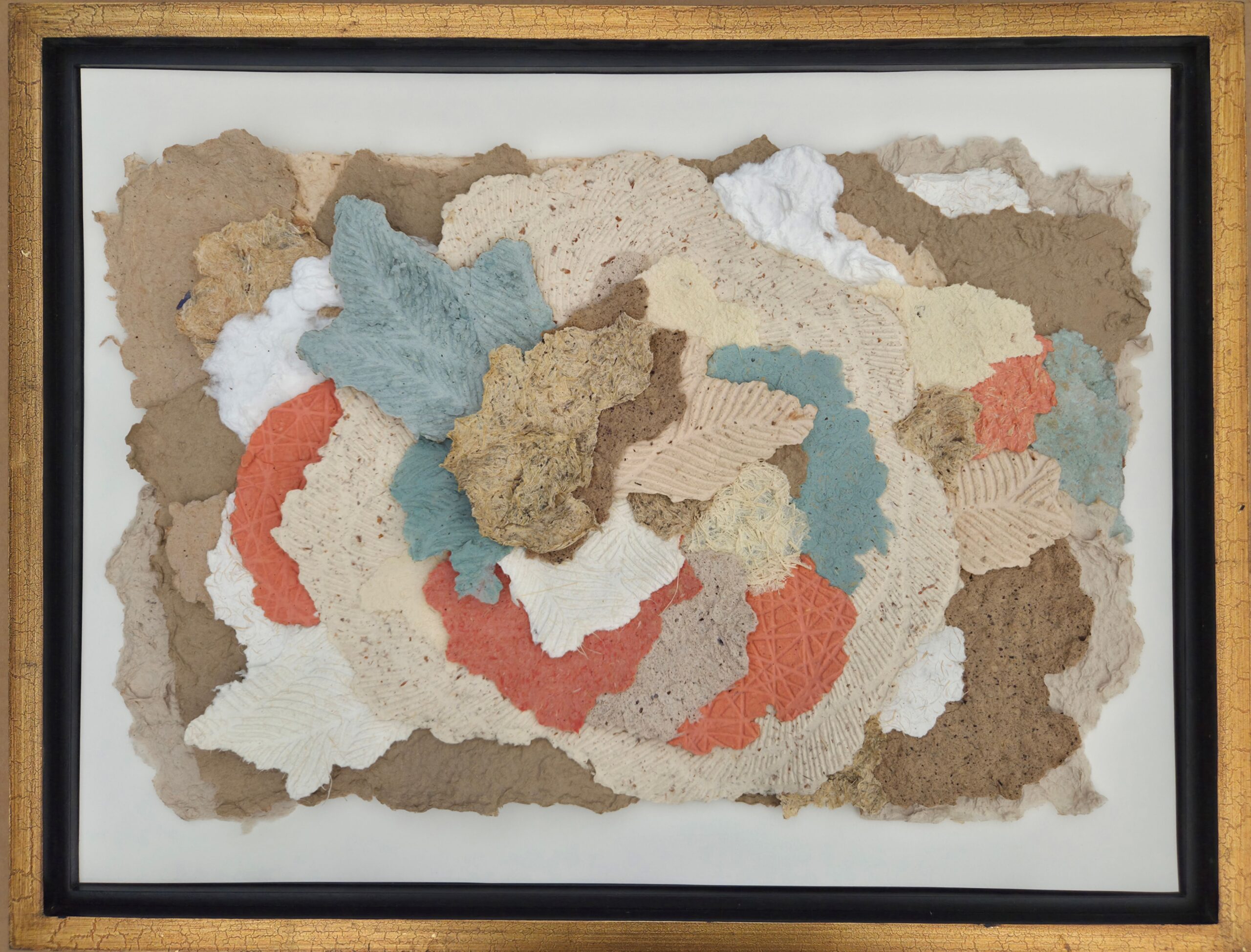 Framed collage of layered torn paper in beige, blue, orange, and white on a white background.